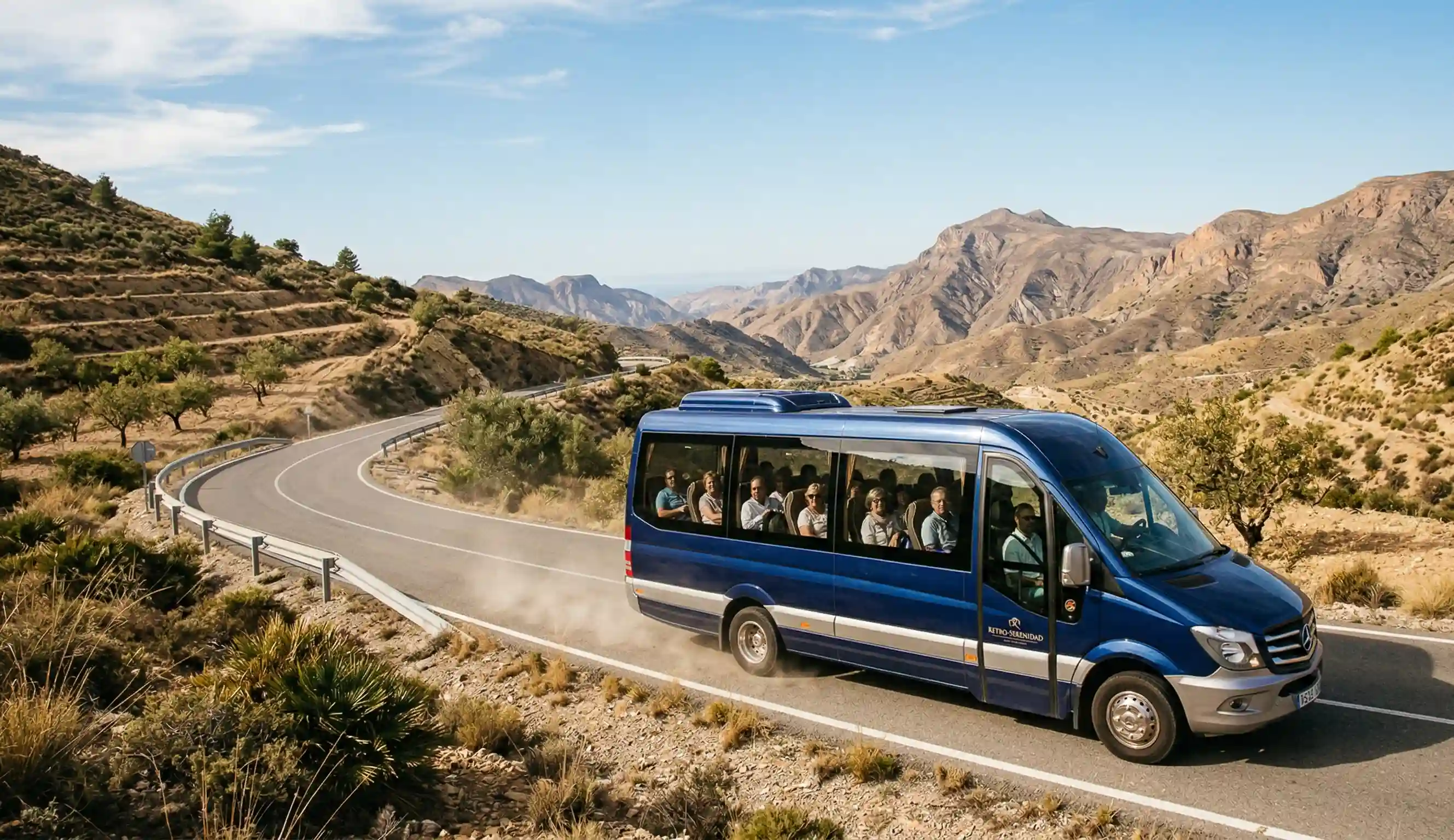 Minibus de alta gama circulando por una carretera de montaña en Almería, trasladando a un grupo de un retiro.
